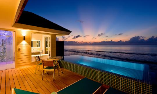 Ocean Pool Villa at dusk at Kandima Maldives